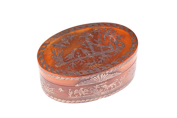 Small ornate box with gold detail